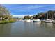 Scenic view of a marina with numerous boats docked, showcasing the waterfront lifestyle at 1610 Treehouse Cir # T130, Sarasota, FL 34231