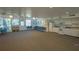Spacious meeting room with ample seating, kitchen amenities, and abundant natural light at 1610 Treehouse Cir # T130, Sarasota, FL 34231