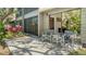 Outdoor patio with chairs, providing a relaxing space to enjoy the surrounding greenery at 1610 Treehouse Cir # T130, Sarasota, FL 34231