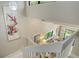 Bright entryway with a white staircase and artistic accents on the wall at 1610 Treehouse Cir # T130, Sarasota, FL 34231