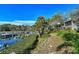 Beautiful view of boats docked at the marina, accessible via a lush green walkway at 1610 Treehouse Cir # T130, Sarasota, FL 34231