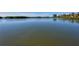 Breathtaking waterfront view of serene waters in a tranquil neighborhood, surrounded by lush greenery and calm waters at 1610 Treehouse Cir # T130, Sarasota, FL 34231