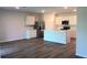 Modern kitchen with white cabinets, stainless steel appliances, and a central island at 17060 James Trl, Parrish, FL 34219