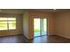 Bright living room with sliding glass doors that fill the space with natural light at 17060 James Trl, Parrish, FL 34219