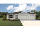 Beautiful single-story home with a two-car garage and manicured front lawn at 17231 Whiskey Creek Trl, Parrish, FL 34219
