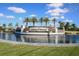 Beautifully landscaped entrance to Lakewood National, featuring a water feature and manicured grounds with palm trees at 17604 Hickok Belt Loop, Bradenton, FL 34211