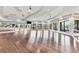 Spacious dance studio with mirrored walls, wood floors, and ample natural light through large windows at 17604 Hickok Belt Loop, Bradenton, FL 34211