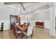 Open-concept dining room with wood table and seating for six at 17604 Hickok Belt Loop, Bradenton, FL 34211