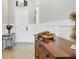 Elegant entryway with neutral walls, decorative wainscoting, a console table and a tiled floor at 17604 Hickok Belt Loop, Bradenton, FL 34211