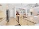 Spacious kitchen island with stainless steel dishwasher and sink, granite countertops, and tile floors at 17604 Hickok Belt Loop, Bradenton, FL 34211