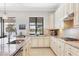Gourmet kitchen featuring granite counters, stainless appliances, gas range, and tile backsplash at 17604 Hickok Belt Loop, Bradenton, FL 34211