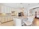 Kitchen features granite countertops, a kitchen island with bar seating, and stainless steel appliances at 17604 Hickok Belt Loop, Bradenton, FL 34211