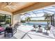 Beautiful outdoor space with a screened-in lanai, and a luxurious pool overlooking the water and greenery at 17604 Hickok Belt Loop, Bradenton, FL 34211