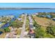 Aerial view of the home's location on a street near the water, showing landscaping at 203 22Nd Ne St, Bradenton, FL 34208