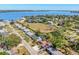 Aerial view of neighborhood, showing home's proximity to water, landscaping, and other houses at 203 22Nd Ne St, Bradenton, FL 34208