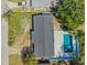 Aerial view of house showing roof, pool, landscaping, parking area, and street access at 203 22Nd Ne St, Bradenton, FL 34208