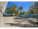 Private pool area with a refreshing pool, ample deck space, and mature landscaping at 203 22Nd Ne St, Bradenton, FL 34208