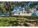 Spacious backyard featuring a private pool, mature trees, and serene setting at 203 22Nd Ne St, Bradenton, FL 34208