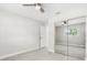 Bright bedroom with mirrored closet doors, neutral walls, and tile flooring at 203 22Nd Ne St, Bradenton, FL 34208