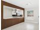 Modern kitchen featuring white cabinetry, stylish range hood, and a convenient breakfast bar at 203 22Nd Ne St, Bradenton, FL 34208