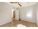 Bedroom with tile flooring, neutral paint, and a doorway to another room at 2261 Linwood Dr, Sarasota, FL 34232