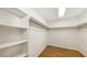 Well-organized walk-in closet featuring ample shelving and hanging space for storage solutions at 2261 Linwood Dr, Sarasota, FL 34232