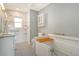 Accessible bathroom includes a walk-in tub, roll-in shower, granite vanity and grab bars at 2332 Canalbluff Pl # 298, Sarasota, FL 34231