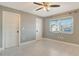 Bright bedroom with a ceiling fan, and a view from the window at 2332 Canalbluff Pl # 298, Sarasota, FL 34231