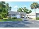Charming single-story home featuring a well-kept lawn, covered carport, and mature landscaping at 2332 Canalbluff Pl # 298, Sarasota, FL 34231