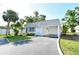 Well-maintained single-story home with covered parking, neat landscaping, and a welcoming facade at 2332 Canalbluff Pl # 298, Sarasota, FL 34231