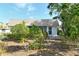 Charming single-story home exterior with lush landscaping in the front yard at 2332 Canalbluff Pl # 298, Sarasota, FL 34231