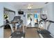 Bright community gym featuring treadmills, stationary bikes, and other fitness equipment for residents' well-being at 2332 Canalbluff Pl # 298, Sarasota, FL 34231