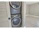 Modern stackable washer and dryer in a dedicated laundry area at 2332 Canalbluff Pl # 298, Sarasota, FL 34231