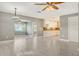 Open living area featuring tile floors, contemporary lighting, and seamless flow to the bright kitchen at 2332 Canalbluff Pl # 298, Sarasota, FL 34231