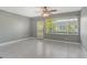 Light-filled living room with fan, large window and access to the yard at 2332 Canalbluff Pl # 298, Sarasota, FL 34231