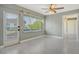 Open living room area with fan and views to the yard and entry hallway at 2332 Canalbluff Pl # 298, Sarasota, FL 34231