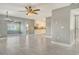 Spacious living room showcasing tile flooring, modern fixtures, and an open layout leading to the kitchen at 2332 Canalbluff Pl # 298, Sarasota, FL 34231