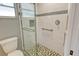Modern shower with decorative tile accents and a glass door at 2332 Canalbluff Pl # 298, Sarasota, FL 34231
