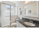Bathroom featuring white vanity with granite countertop and enclosed shower at 2439 Sonoma W Dr, Nokomis, FL 34275