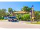 Nokomis Beach parking with a view of the lifeguard station and beachfront access surrounded by lush greenery at 2439 Sonoma W Dr, Nokomis, FL 34275