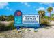 Nokomis Beach sign displaying the Sarasota County Parks and Recreation details with palm trees in the background at 2439 Sonoma W Dr, Nokomis, FL 34275