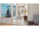 Bright foyer with tile flooring leading to an elegant dining room and french doors to the lanai at 2439 Sonoma W Dr, Nokomis, FL 34275