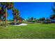 Lush North Jetty Park featuring picnic areas, playground equipment, and open green spaces for recreation and relaxation at 2439 Sonoma W Dr, Nokomis, FL 34275
