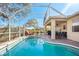 The screened-in pool area connects to the covered patio for seamless indoor/outdoor living and entertaining at 2439 Sonoma W Dr, Nokomis, FL 34275
