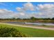 Beautiful water view with motorized boat driving by, close to the homes in the community at 2439 Sonoma W Dr, Nokomis, FL 34275