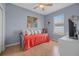 Bedroom featuring a day bed, light walls, hardwood floors, and a window to the outside at 259 Golden Harbour Trl, Bradenton, FL 34212