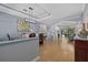 Open concept dining area featuring modern lighting and wood floors at 259 Golden Harbour Trl, Bradenton, FL 34212