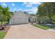 Charming single-story home with brick paver driveway and a well-manicured front yard at 259 Golden Harbour Trl, Bradenton, FL 34212