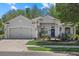 Charming single-story home featuring a two car garage and a landscaped front yard at 259 Golden Harbour Trl, Bradenton, FL 34212