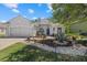 Charming single-story home with a well-manicured lawn and a welcoming blue front door at 259 Golden Harbour Trl, Bradenton, FL 34212